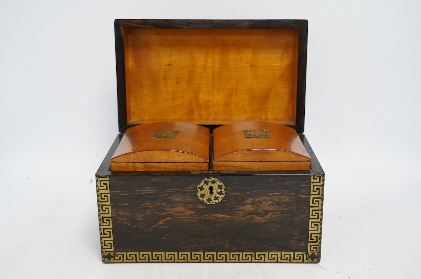An early 19th century brass inlaid coromandel tea caddy with birch lining, 25cm wide. Condition - fair